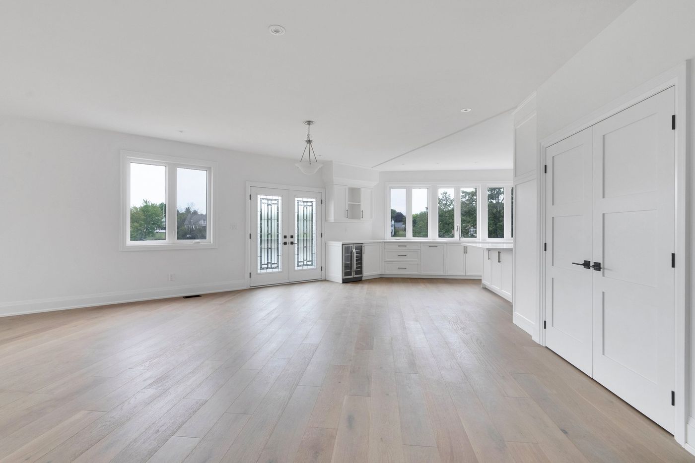 Open-concept great room with garden doors